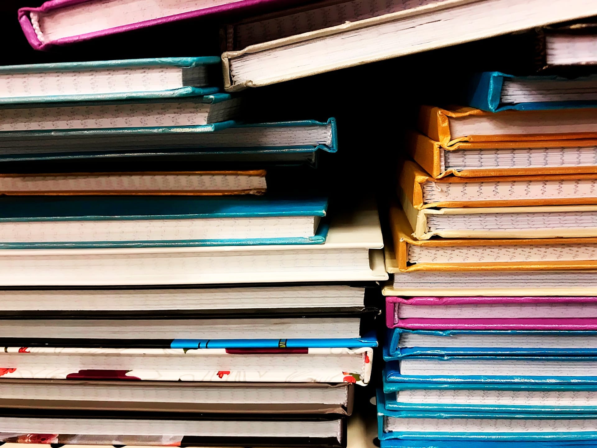Stacks of teacher manuals and curriculum materials
